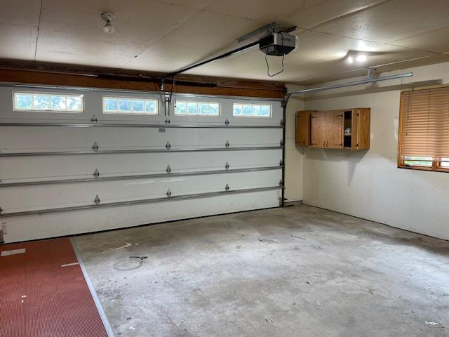 675 10th St, Granite Falls, MN 56241 - garage featuring a garage door opener