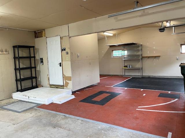 675 10th St, Granite Falls, MN 56241 - garage featuring a garage door opener