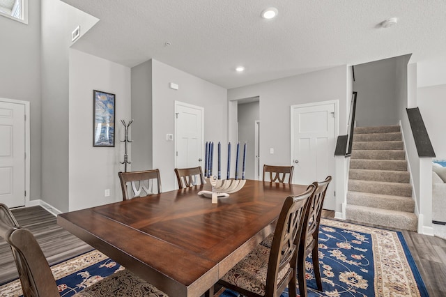 10896 Territorial Trl, Dayton, MN 55369 - dining room featuring visible vents, a textured ceiling, wood finished floors, and stairway