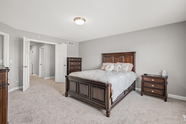 bedroom with light carpet