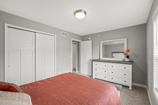 10896 Territorial Trl, Dayton, MN 55369 - bedroom featuring light colored carpet, baseboards, visible vents, and a closet