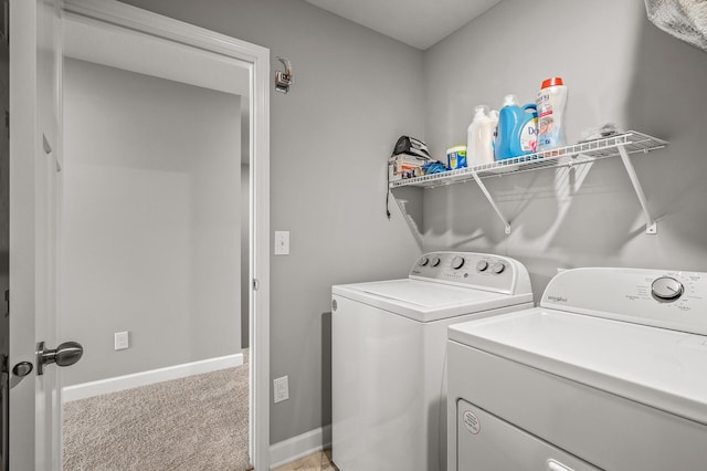 washroom featuring separate washer and dryer and light colored carpet