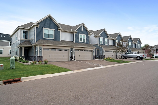 10896 Territorial Trl, Dayton, MN 55369 - view of property with driveway, a front yard, a residential view, a garage, and stone siding