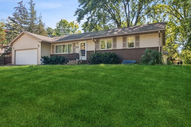 ranch-style house with a garage and a front yard