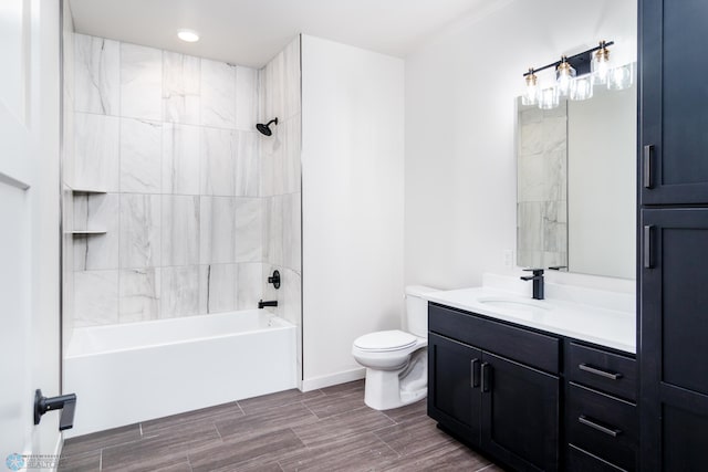 full bathroom with tiled shower / bath combo, vanity, and toilet