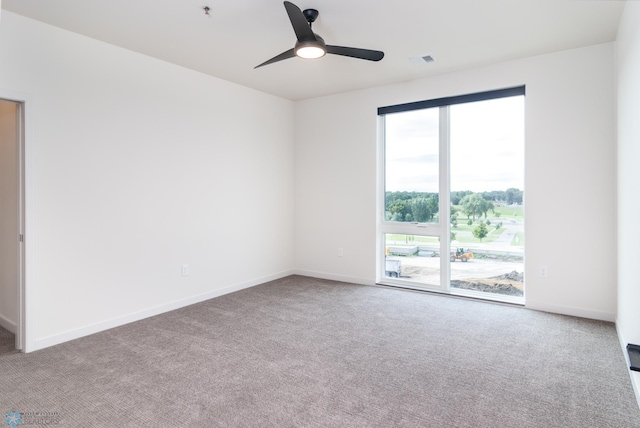 carpeted empty room with ceiling fan