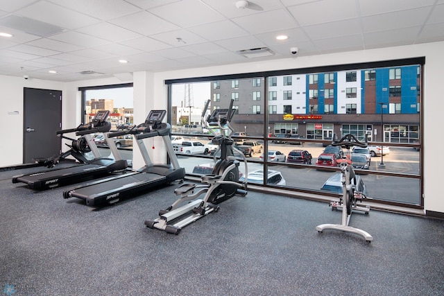 exercise room featuring a paneled ceiling