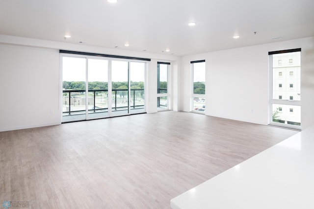 spare room featuring light wood-type flooring