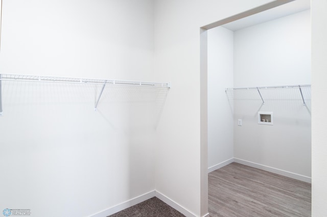 spacious closet featuring light hardwood / wood-style floors