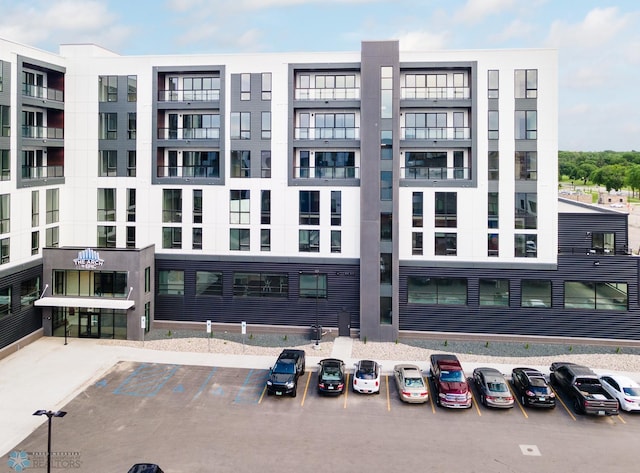 view of property featuring uncovered parking