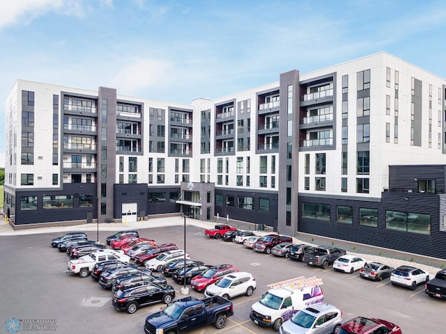 view of property with uncovered parking