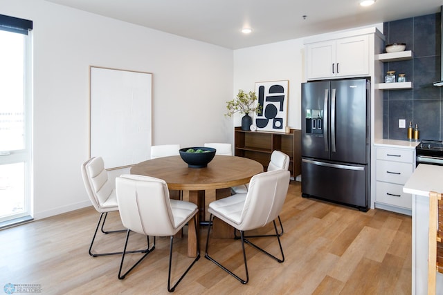 dining area with recessed lighting and light wood-style floors