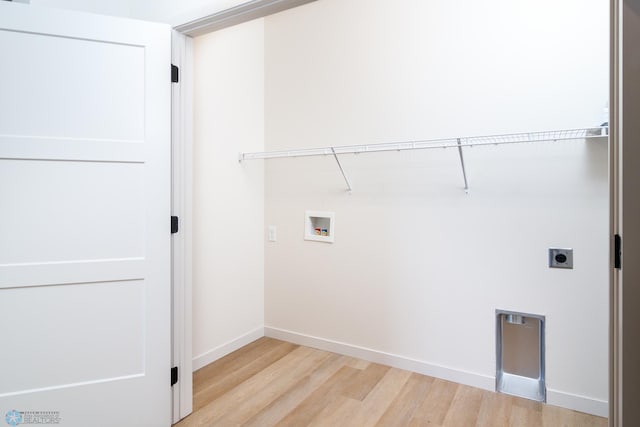 laundry room featuring washer hookup, light wood finished floors, baseboards, and electric dryer hookup