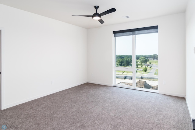 carpeted empty room featuring ceiling fan