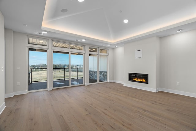 unfurnished living room featuring wood-type flooring