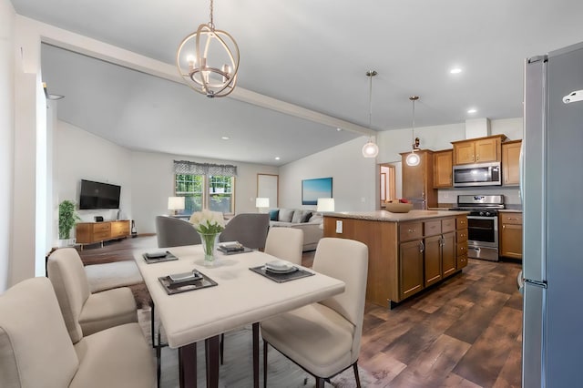 dining room featuring dark hardwood / wood-style floors, an inviting chandelier, and vaulted ceiling