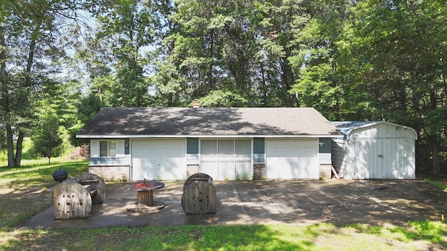 view of shed featuring an outdoor fire pit