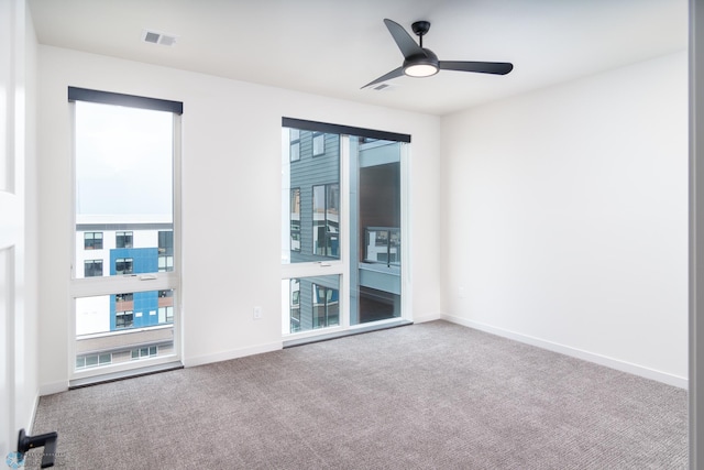 empty room with carpet and ceiling fan