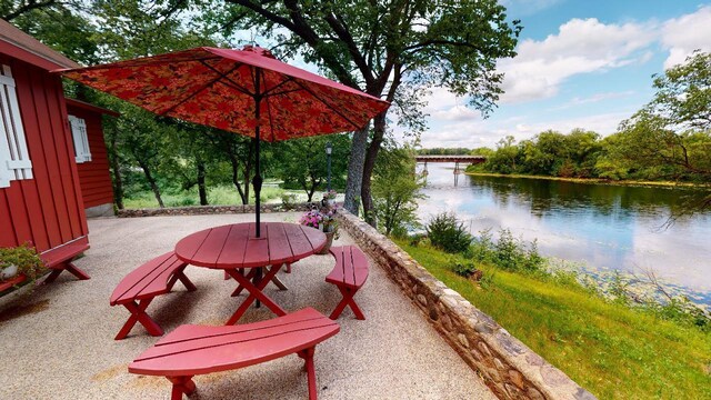 view of patio featuring a water view