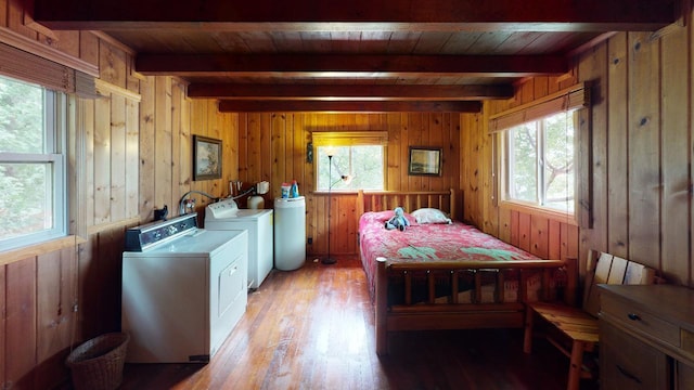 bedroom featuring washer and clothes dryer, wooden walls, beamed ceiling, light hardwood / wood-style flooring, and wood ceiling