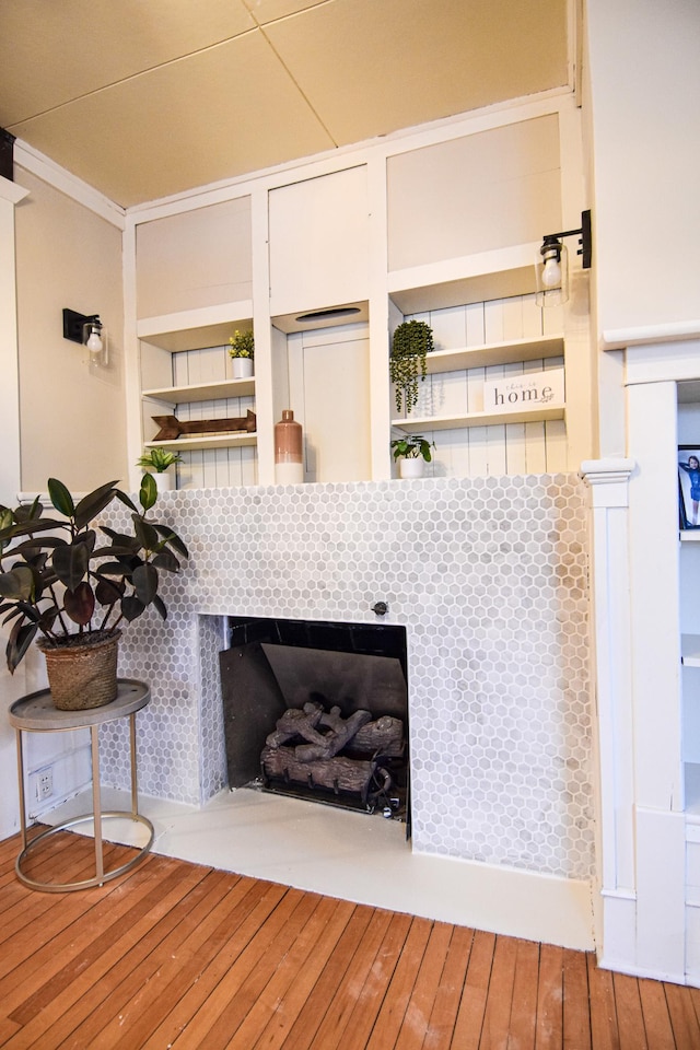 details featuring hardwood / wood-style flooring and ornamental molding