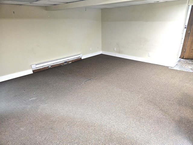 carpeted spare room with baseboard heating