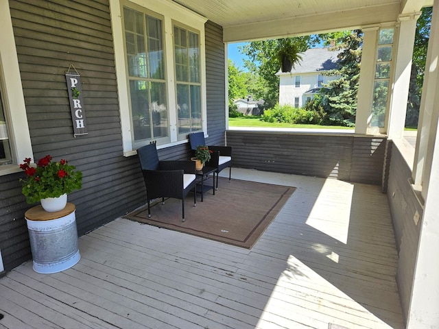 wooden deck featuring covered porch