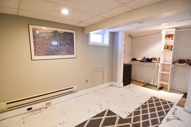 721 Labree Ave N, Thief River Falls, MN 56701 - basement with a baseboard heating unit, a paneled ceiling, baseboards, and recessed lighting