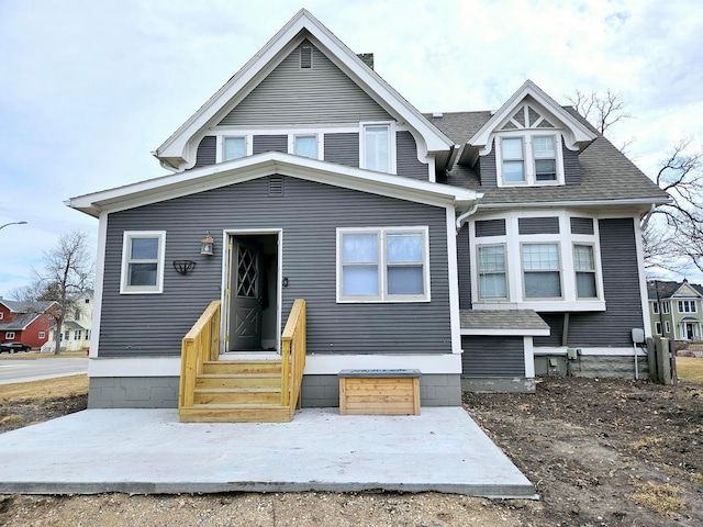 721 Labree Ave N, Thief River Falls, MN 56701 - view of front of property with a shingled roof and entry steps