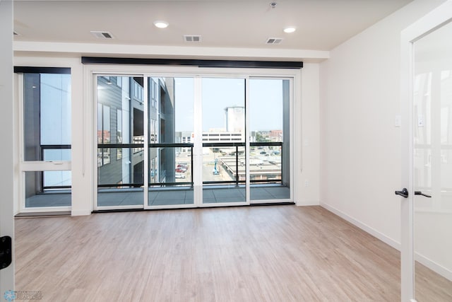 empty room with light wood-type flooring