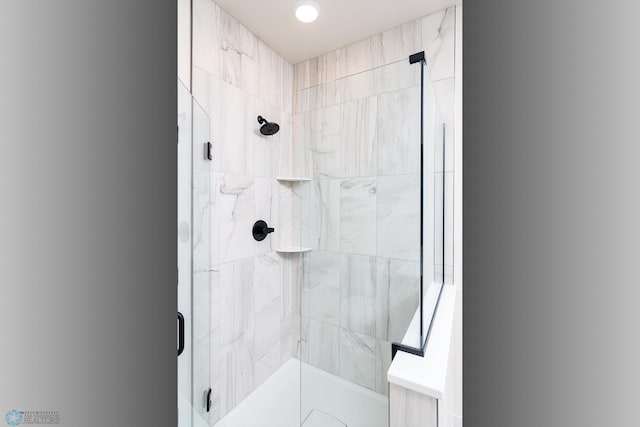 bathroom with an enclosed shower