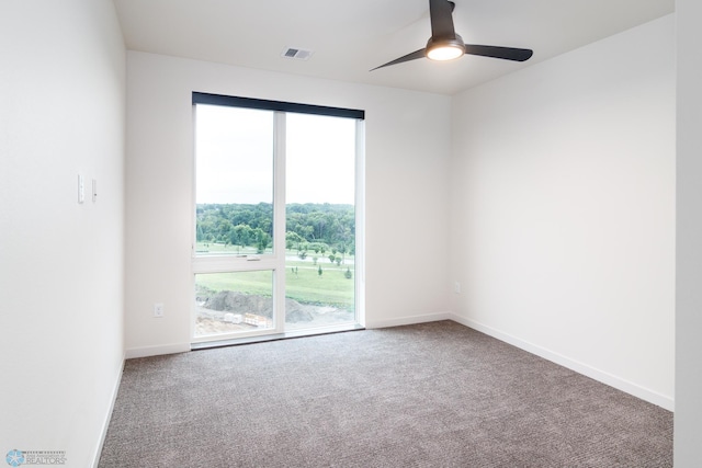 empty room with carpet flooring and ceiling fan