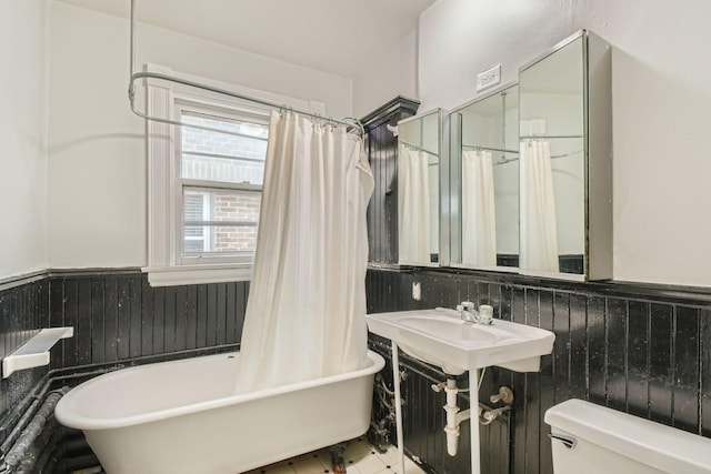 bathroom with sink, toilet, tile patterned flooring, and a bath