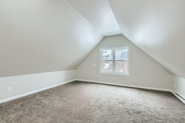 bonus room with carpet flooring and lofted ceiling