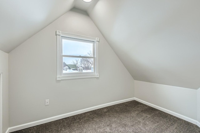 bonus room featuring lofted ceiling and carpet