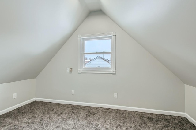 bonus room featuring carpet flooring and lofted ceiling