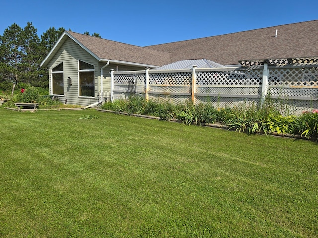 view of home's exterior with a lawn