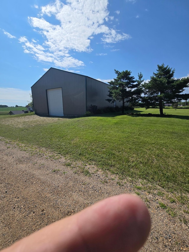 exterior space with a garage and an outdoor structure