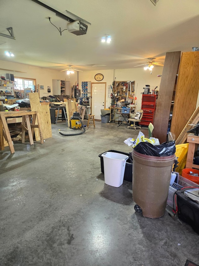 garage with a garage door opener, a workshop area, and ceiling fan