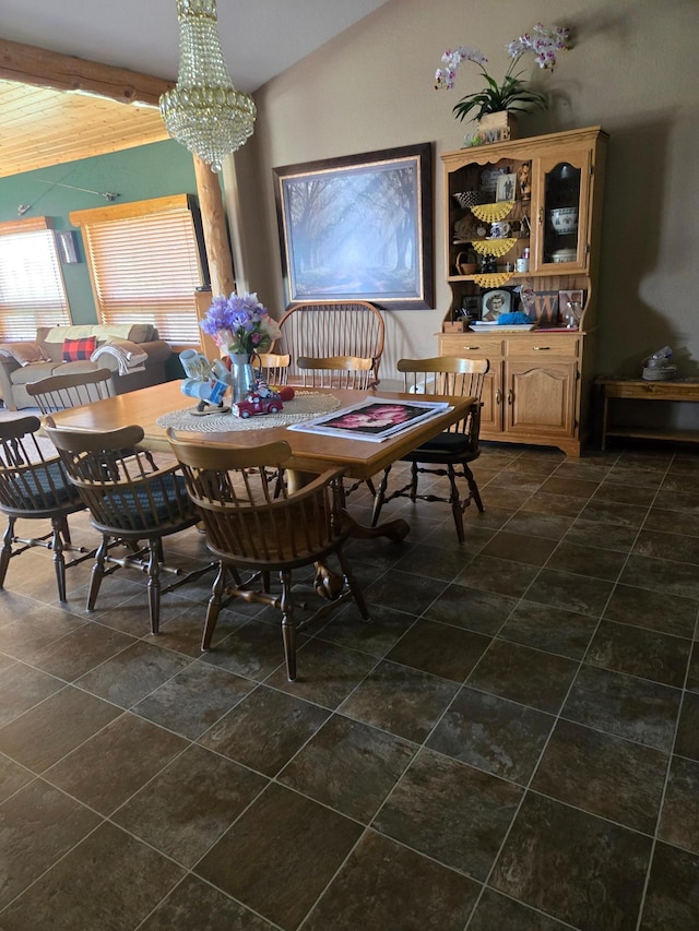 tiled dining space featuring a notable chandelier and vaulted ceiling with beams