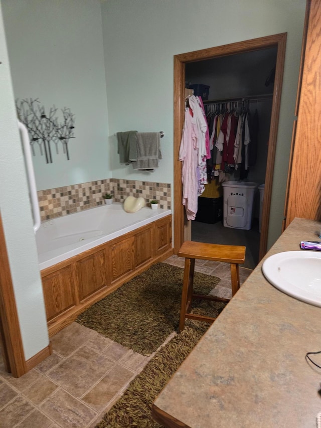 bathroom with sink, tile patterned floors, and a bathing tub