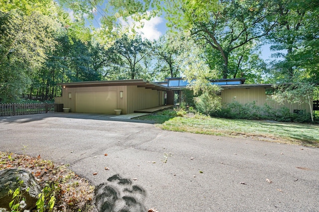 ranch-style house featuring a garage