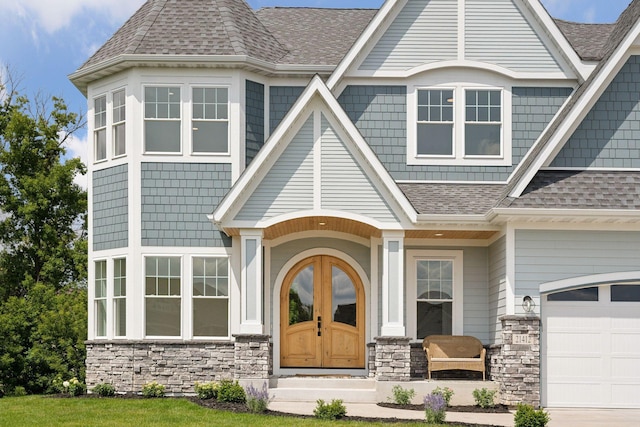 view of exterior entry with a garage