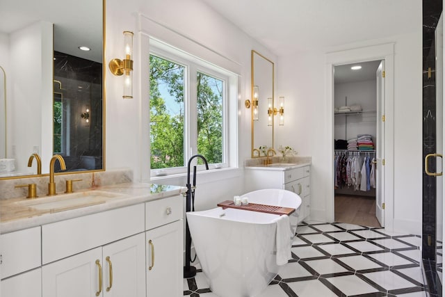 21412 Poate Ct, Rogers, MN 55374 - bathroom with a shower stall, a healthy amount of sunlight, and a sink