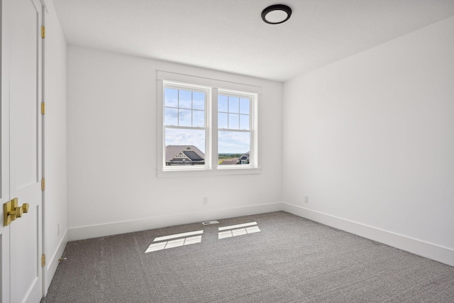 unfurnished room with carpet