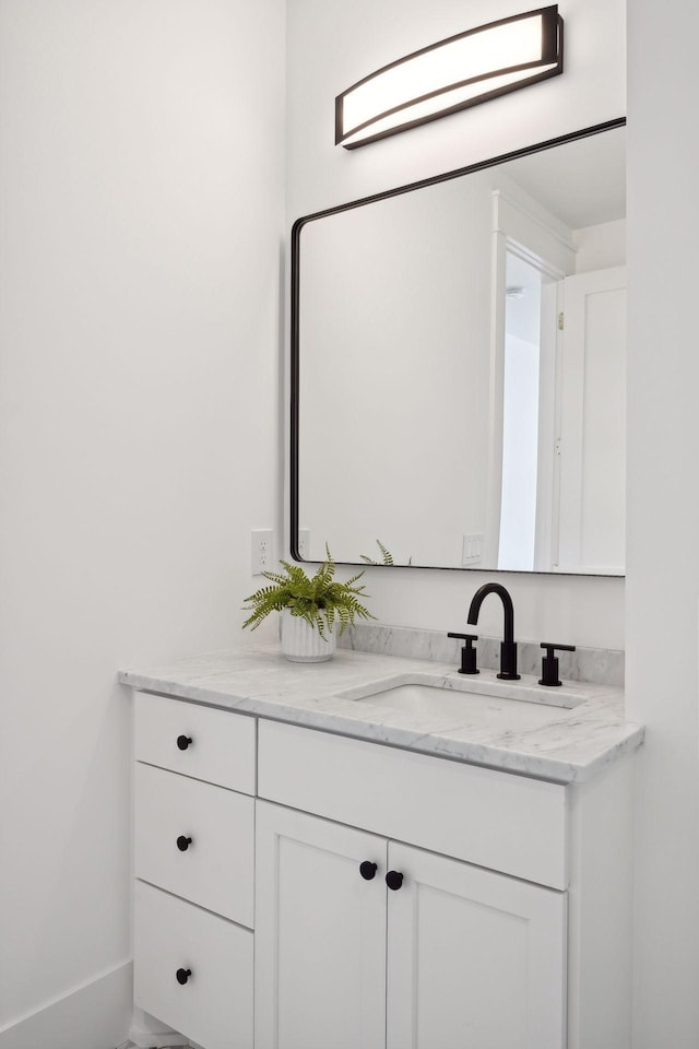 21412 Poate Ct, Rogers, MN 55374 - bathroom featuring baseboards and vanity