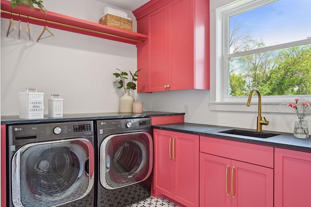 laundry room featuring cabinets, independent washer and dryer, tile patterned flooring, and sink