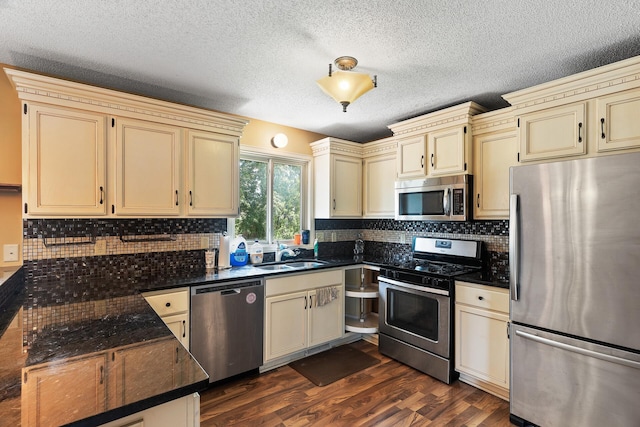 kitchen with stainless steel appliances and cream cabinets