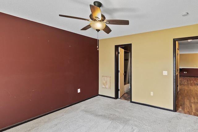 unfurnished bedroom with carpet and ceiling fan