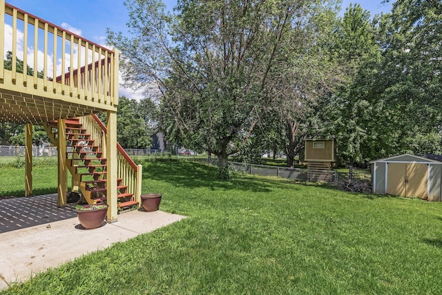 view of yard with a storage unit and a deck